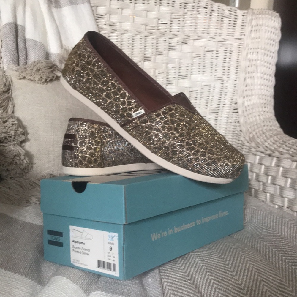 Brown and gold slip-on Toms